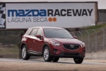 Picture of a driving 2015 Mazda CX-5 from a front right three-quarter perspective