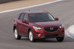 Picture of a driving 2015 Mazda CX-5 from a front right perspective