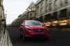 Picture of a driving 2016 Mazda CX-5 AWD in Soul Red Metallic from a front right perspective