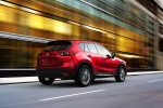 Picture of a driving 2016 Mazda CX-5 AWD in Soul Red Metallic from a rear right three-quarter perspective