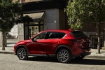 Picture of a 2017 Mazda CX-5 Grand Touring AWD in Soul Red Crystal Metallic from a rear left three-quarter perspective