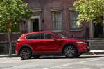 Picture of a driving 2017 Mazda CX-5 Grand Touring AWD in Soul Red Crystal Metallic from a right side perspective