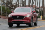 Picture of a driving 2018 Mazda CX-5 Grand Touring AWD in Soul Red Crystal Metallic from a frontal perspective
