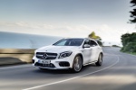Picture of a driving 2019 Mercedes-AMG GLA 45 4MATIC in Polar White from a front left three-quarter perspective