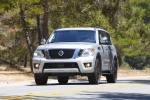 Picture of a driving 2017 Nissan Armada Platinum in Brilliant Silver from a frontal perspective