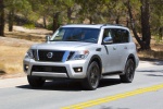 Picture of a driving 2017 Nissan Armada Platinum in Brilliant Silver from a front left perspective