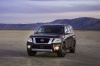 Picture of a 2018 Nissan Armada Platinum in Forged Copper from a front left perspective
