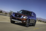 Picture of a driving 2019 Nissan Armada Platinum in Forged Copper from a front left perspective