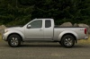 Picture of a 2014 Nissan Frontier King Cab PRO-4X 4WD in Brilliant Silver from a side perspective
