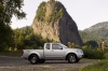 Picture of a 2014 Nissan Frontier King Cab PRO-4X 4WD in Brilliant Silver from a side perspective