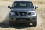 Picture of a driving 2014 Nissan Frontier Crew Cab PRO-4X 4WD in Night Armor from a frontal perspective