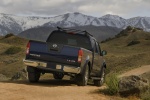 Picture of a 2014 Nissan Frontier Crew Cab PRO-4X 4WD in Navy Blue from a rear right perspective