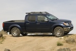 Picture of a 2014 Nissan Frontier Crew Cab PRO-4X 4WD in Navy Blue from a side perspective