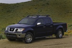 Picture of a 2014 Nissan Frontier Crew Cab PRO-4X 4WD in Navy Blue from a front left three-quarter perspective