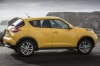 Picture of a 2015 Nissan Juke SL AWD in Solar Yellow from a side perspective