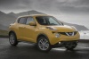 Picture of a 2015 Nissan Juke SL AWD in Solar Yellow from a front right three-quarter perspective