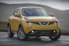 Picture of a 2015 Nissan Juke SL AWD in Solar Yellow from a frontal perspective