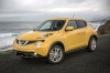 Picture of a 2015 Nissan Juke SL AWD in Solar Yellow from a front left three-quarter perspective