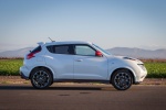 Picture of a 2016 Nissan Juke NISMO in White Pearl from a side perspective