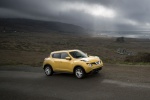 Picture of a 2016 Nissan Juke SL AWD in Solar Yellow from a front right three-quarter perspective