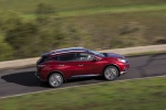 Picture of a driving 2017 Nissan Murano in Cayenne Red Metallic from a right side perspective