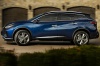 Picture of a driving 2019 Nissan Murano Platinum AWD in Deep Blue Pearl from a left side perspective