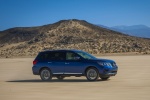 Picture of a driving 2018 Nissan Pathfinder Platinum 4WD in Caspian Blue from a front right three-quarter perspective