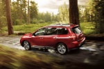 Picture of a driving 2018 Nissan Pathfinder Platinum 4WD in Scarlet Ember from a rear left three-quarter perspective