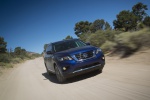 Picture of a driving 2019 Nissan Pathfinder Platinum 4WD in Caspian Blue Metallic from a front right perspective