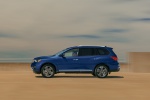 Picture of a driving 2019 Nissan Pathfinder Platinum 4WD in Caspian Blue Metallic from a side perspective