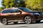Picture of a driving 2019 Nissan Pathfinder Platinum 4WD in Mocha Almond Pearl from a front right three-quarter perspective