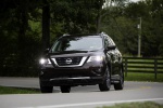 Picture of a driving 2019 Nissan Pathfinder Platinum 4WD in Mocha Almond Pearl from a front left perspective