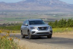 Picture of a driving 2019 Nissan Pathfinder Platinum 4WD in Brilliant Silver Metallic from a front right perspective