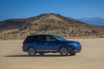 Picture of a driving 2020 Nissan Pathfinder Platinum 4WD in Caspian Blue Metallic from a front right three-quarter perspective