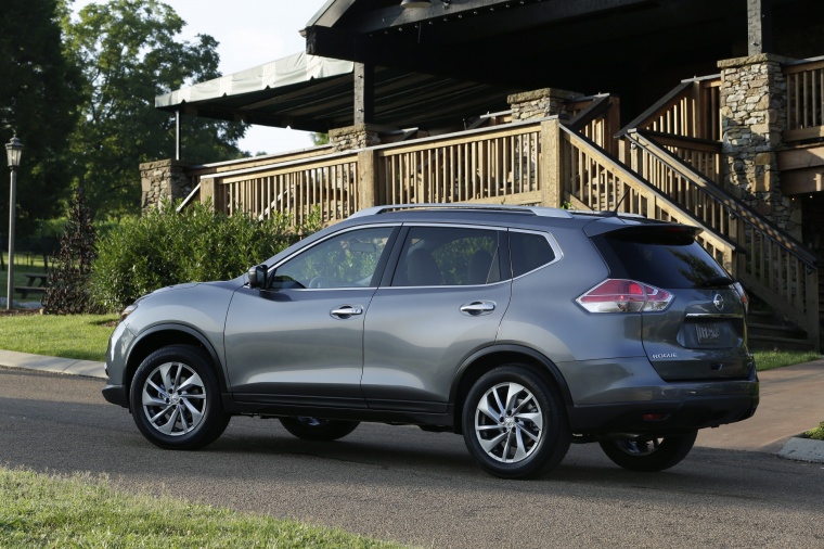 Picture of a 2014 Nissan Rogue SL AWD in Graphite Blue from a rear left three-quarter perspective