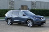 Picture of a 2014 Nissan Rogue SL AWD in Graphite Blue from a front right three-quarter perspective