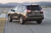 Picture of a 2014 Nissan Rogue SL AWD in Super Black from a rear left perspective