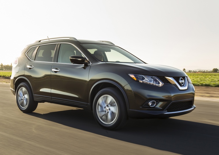 Picture of a driving 2015 Nissan Rogue SL AWD in Super Black from a front right three-quarter perspective