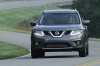 Picture of a driving 2015 Nissan Rogue SL AWD in Arctic Blue Metallic from a frontal perspective