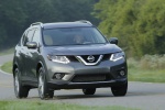 Picture of a driving 2015 Nissan Rogue SL AWD in Arctic Blue Metallic from a front right perspective