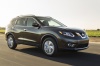 Picture of a driving 2016 Nissan Rogue SL AWD in Magnetic Black from a front right three-quarter perspective