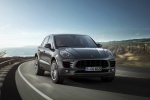 Picture of a driving 2015 Porsche Macan S in Agate Gray Metallic from a front right perspective