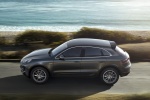 Picture of a driving 2015 Porsche Macan S in Agate Gray Metallic from a side perspective