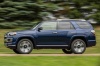 Picture of a driving 2018 Toyota 4Runner Limited in Nautical Blue Pearl from a side perspective