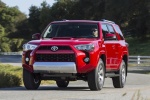 Picture of a driving 2018 Toyota 4Runner TRD Off Road in Barcelona Red Metallic from a front left perspective