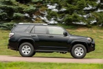 Picture of a driving 2018 Toyota 4Runner SR5 in Midnight Black Metallic from a side perspective