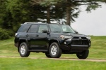 Picture of a driving 2018 Toyota 4Runner SR5 in Midnight Black Metallic from a front right three-quarter perspective