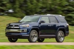 Picture of a driving 2018 Toyota 4Runner Limited in Nautical Blue Pearl from a front left three-quarter perspective