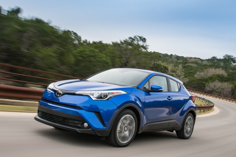 Picture of a driving 2018 Toyota C-HR in Blue Eclipse Metallic from a front left perspective