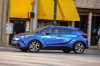 Picture of a driving 2018 Toyota C-HR in Blue Eclipse Metallic from a front left three-quarter perspective